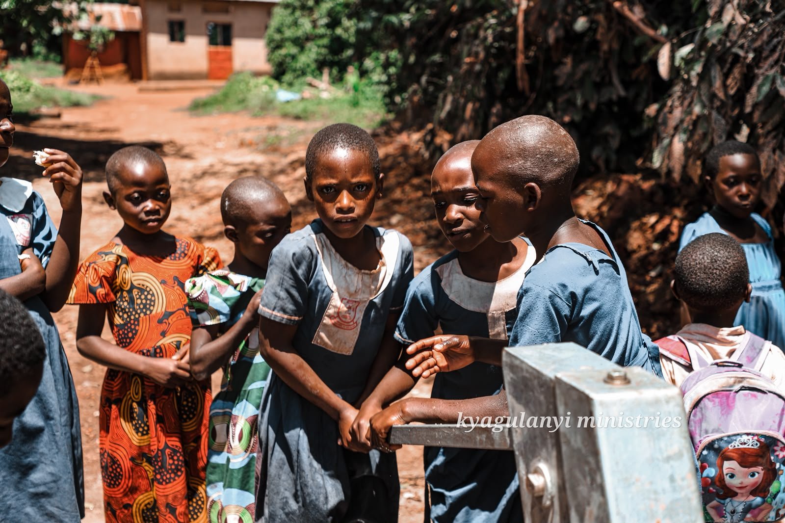 Children and community members celebrating the work of Kyagulanyi Ministries